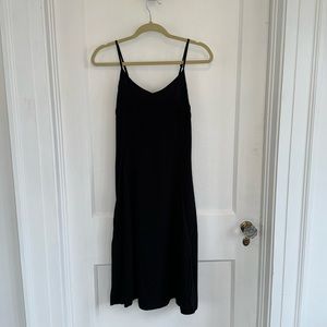 Black slip dress. Adjustable straps Smocked back 41" total length Synthetic SZ S